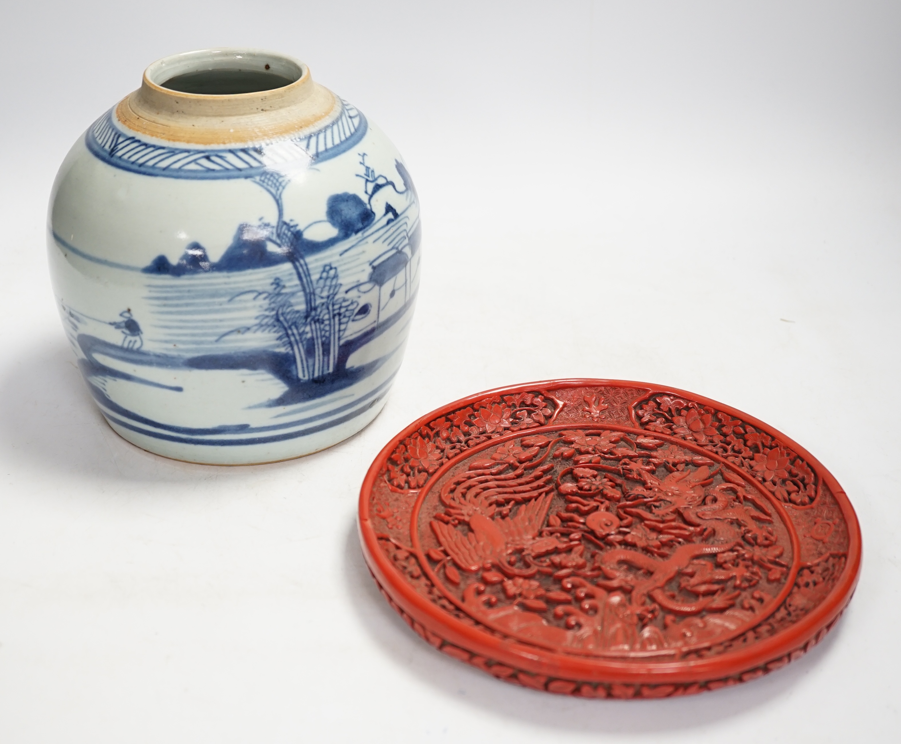 A Chinese blue and white jar and red cinnabar style lacquer tray, jar 16.5cm high. Condition - fair